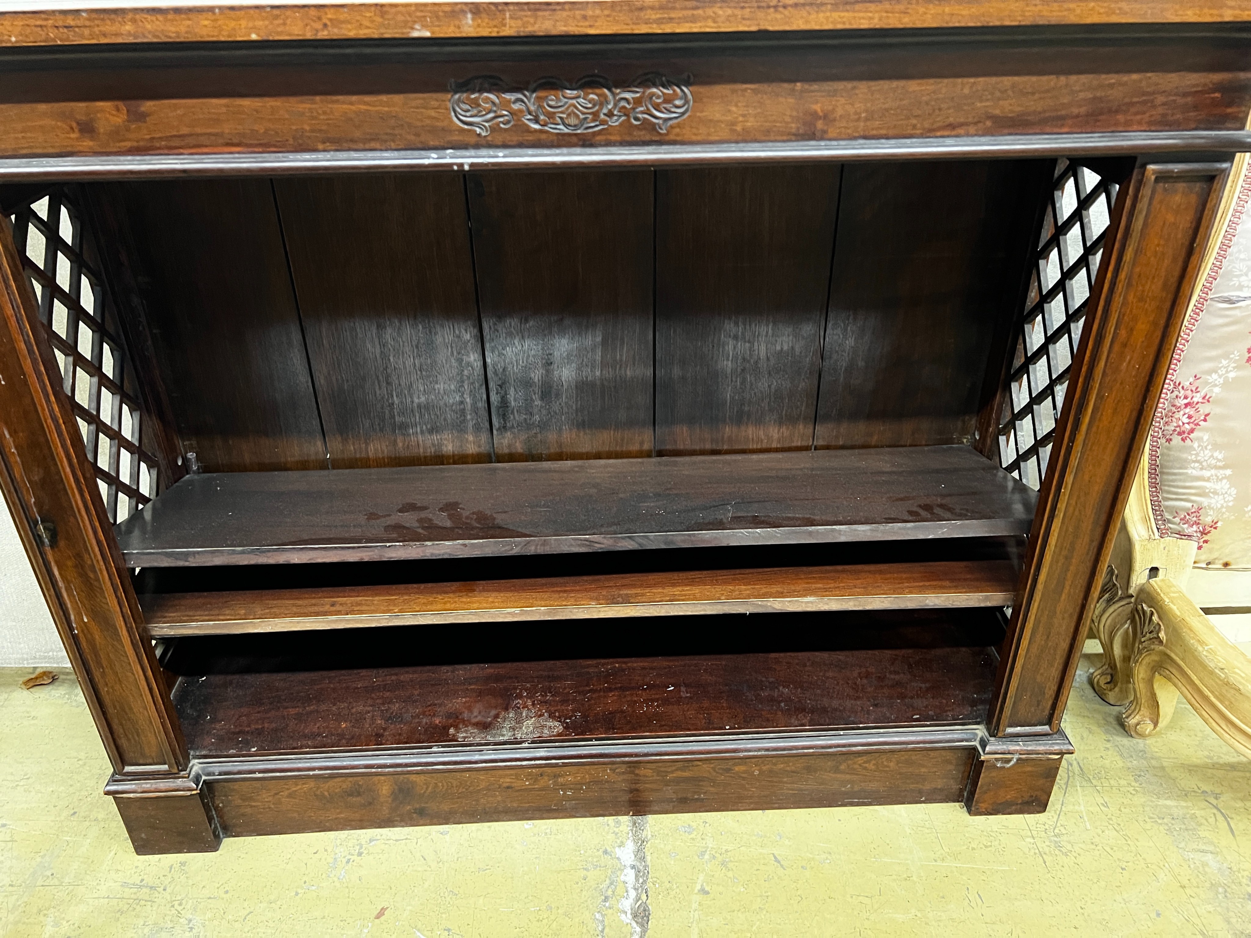 A reproduction hardwood dwarf open bookcase, width 107cm, depth 33cm, height 85cm